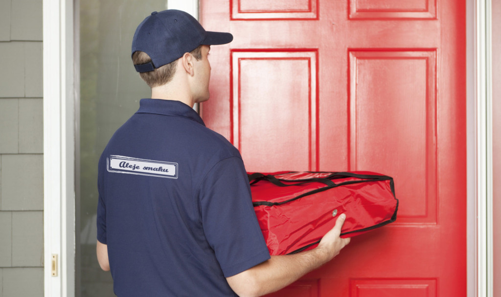 Pizza Delivery Man Delivering Take-out Package to Customer's Doo